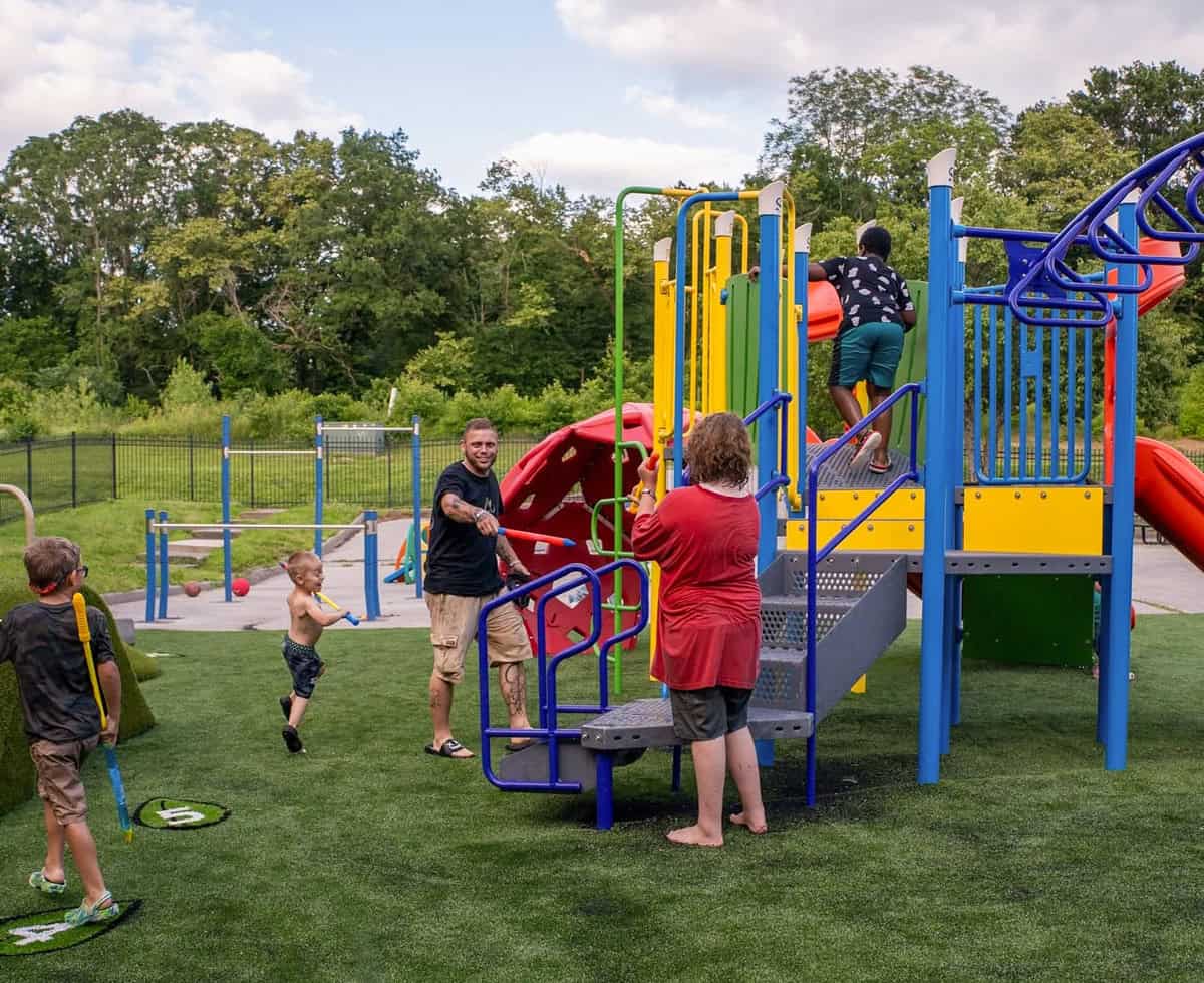 Families and their children enjoyed the new River of Refuge playground at an opening event on June 22